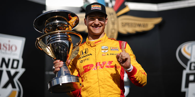 Alex Palou poses with the trophy in victory lane for the 2024 Sonsio Grand Prix