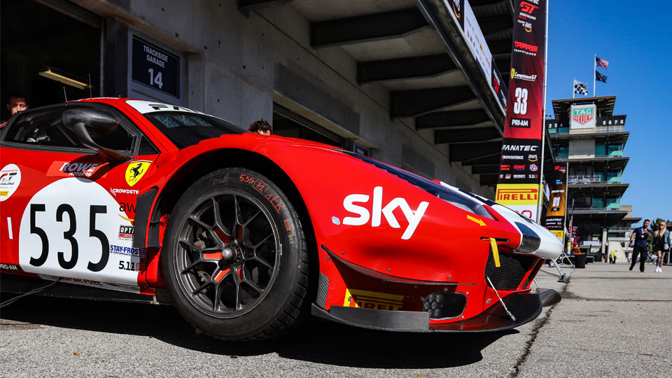 A Ferrari in the Paddock at Indianapolis Motor Speedway with the Pagoda in the background