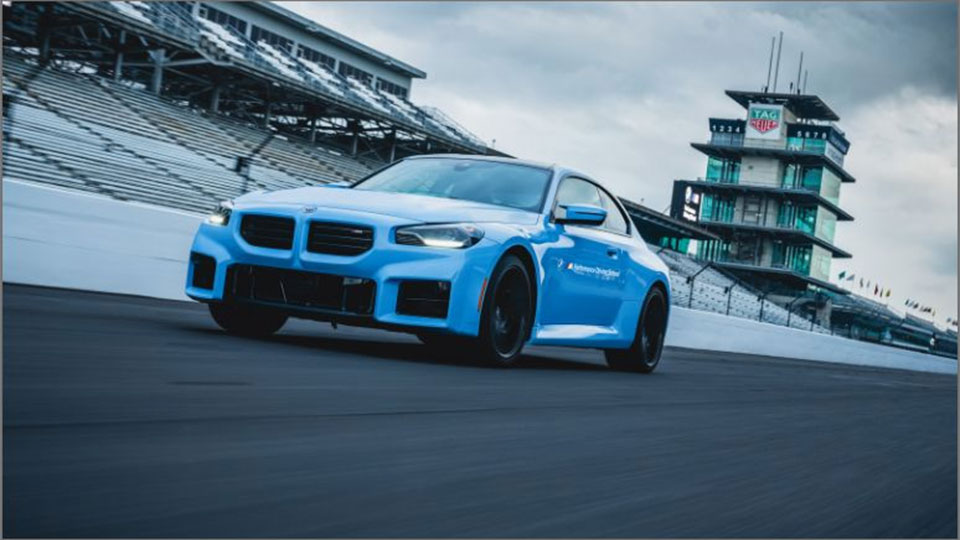 A BMW drives at IMS