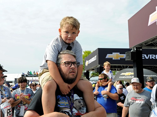 A son on the shoulders of his father