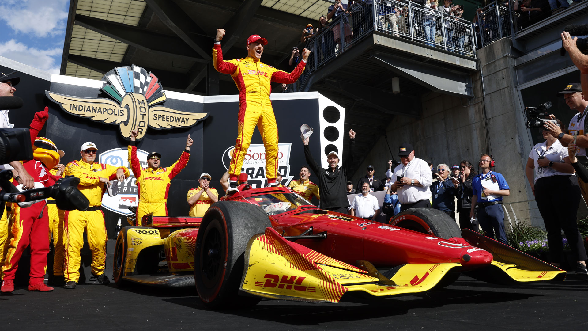 Alex Palou and crew celebrate on victory podium