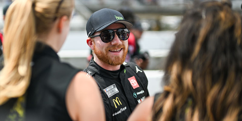 Tyler Reddick celebrates qualifying on pole for the Brickyard 400 in 2024.